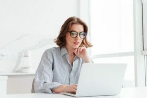 charming businesswoman glasses striped shirt working with laptop computer while siting home 171337 13027